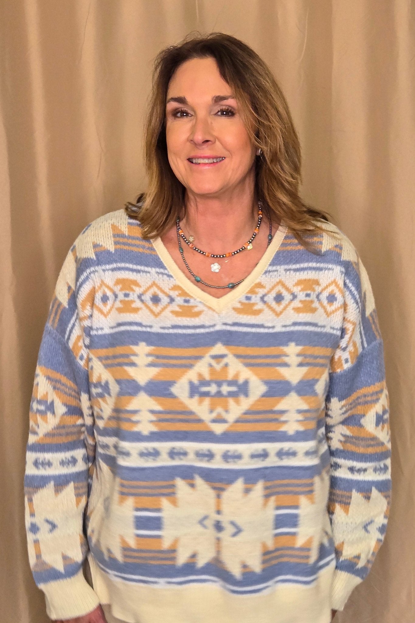 Main Strip Southwestern Knit Sweater — Oversized V-Neck with Bold Blue, Tan & Cream Print