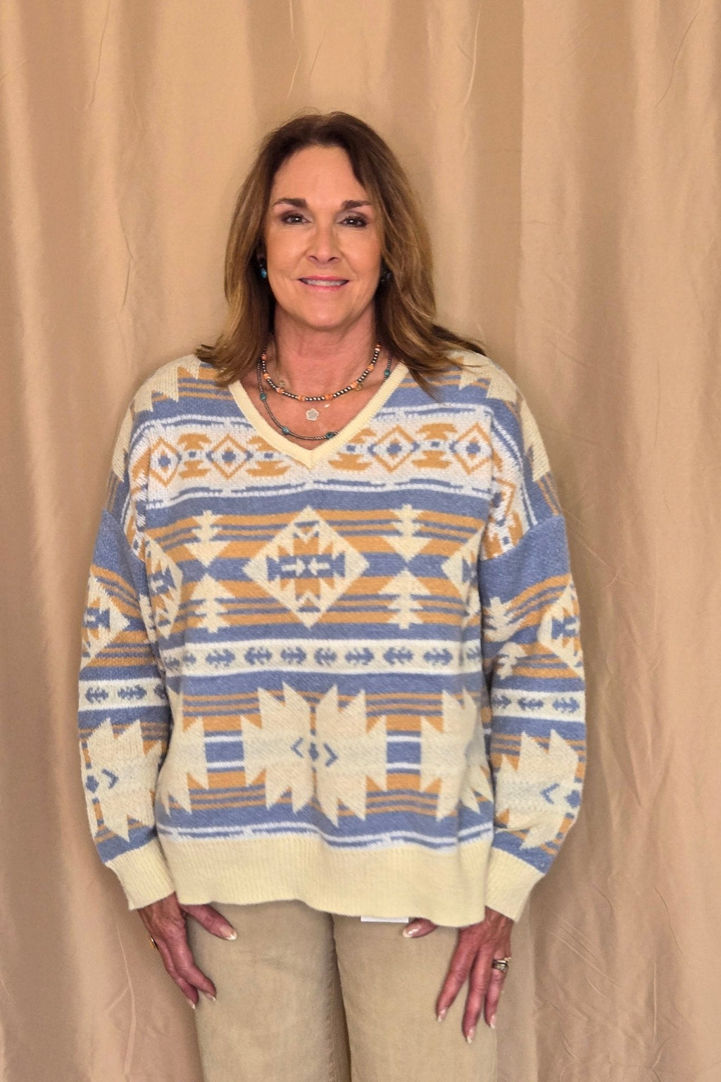 Main Strip Southwestern Knit Sweater — Oversized V-Neck with Bold Blue, Tan & Cream Print